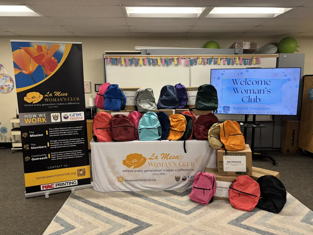 Colorful backpacks displayed by the La Mesa Woman's Club before the Bancroft Elementary Back-to-School Backpack Presentation.