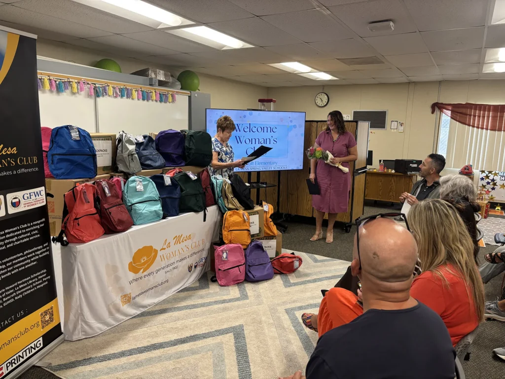 La Mesa Woman's Club presents donated backpacks to Bancroft Elementary educators during the Back-to-School Backpack Presentation.