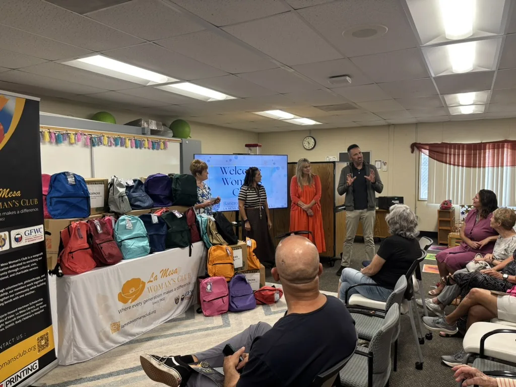 La Mesa Woman’s Club members presenting backpacks for Bancroft Elementary students