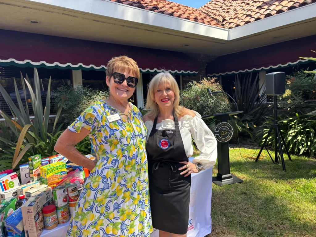 LMWC President and Debra Childers of Feeding the Flock
